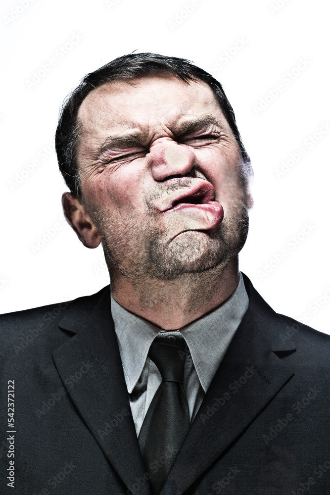 Mature man face against glass window, close up Mature man face against glass window, close up