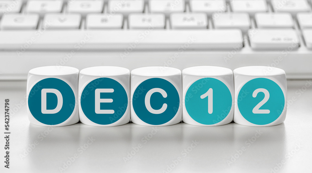 Letter dice in front of a keyboard - December 12