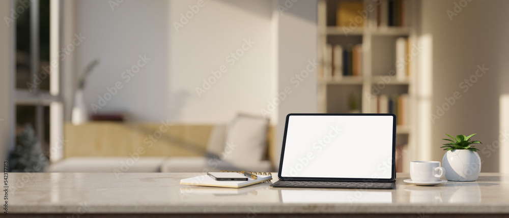 Workspace marble tabletop with tablet mockup and stuff over blurred minimal living room