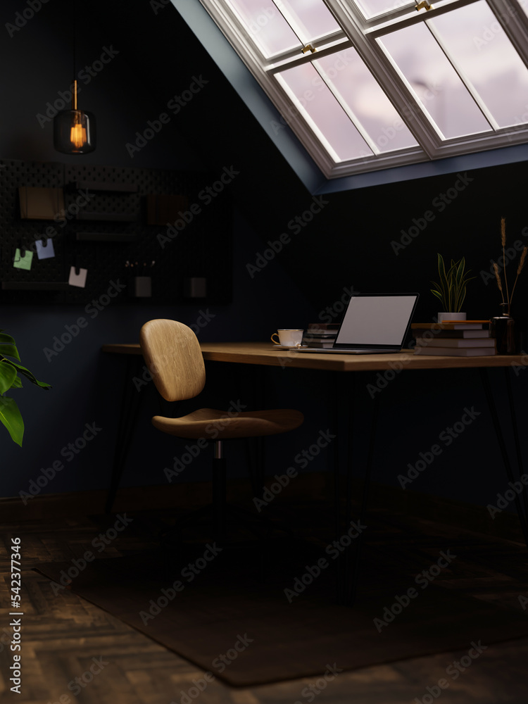 Modern stylish home working place in attic room with laptop on table and skylight window