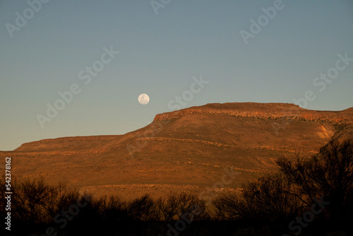 View of Biedouw full moon rising in the arid Cederberg wilderness, Western Cape, South Africa. photo