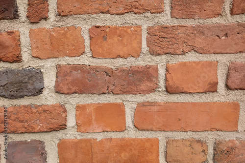 Texture of a concrete wall made of red bricks. Building background.