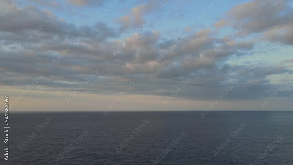 Rotating drone shot of the Mediterranean sea during golden hour capturing a sunset and mountains at Sa Calobra, Mallorca, Spain. Rotating drone shot of the Mediterranean sea during golden hour capturing a sunset and mountains at Sa Calobra, Mallorca, Spain.