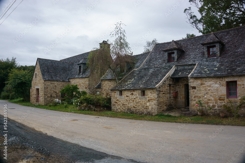 Village of Kernevez, traditional stone houses with street, Botmeur, Brittany, France