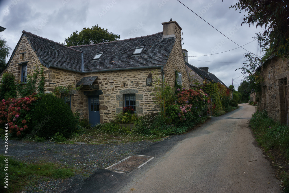 Village of Kernevez, traditional stone houses with street, Botmeur, Brittany, France Village of Kernevez, traditional stone houses with street, Botmeur, Brittany, France