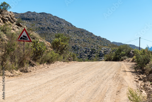 Steep descend warning sign at top of Middelberg Pass photo