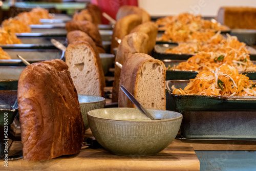 Copenhagen, Denmark Bread, coleslaw and a green sauce prepared in a restaurant for a dinner service. photo