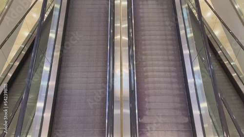 movement of an empty moving walkway. Movement of passengers. Travelator in the shopping center