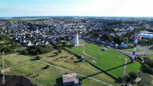 La Hève lighthouse on cliff with Sainte-Adresse city in background, France. Aerial orbiting photo