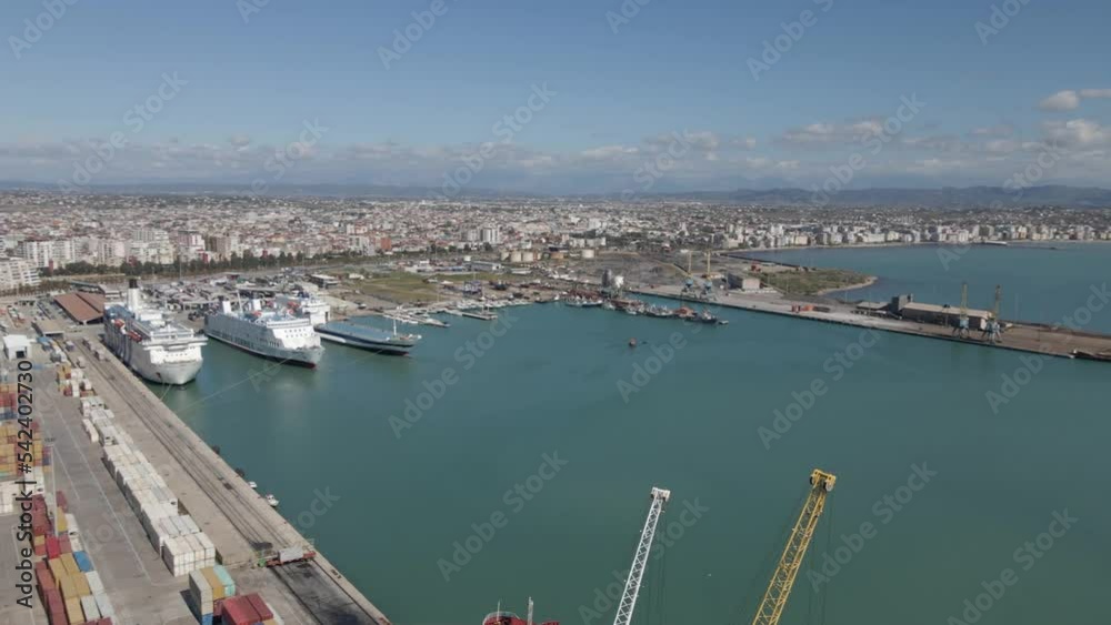 Aerial pan from Durres Container Port to beach waterfront on Adriatic Aerial pan from Durres Container Port to beach waterfront on Adriatic