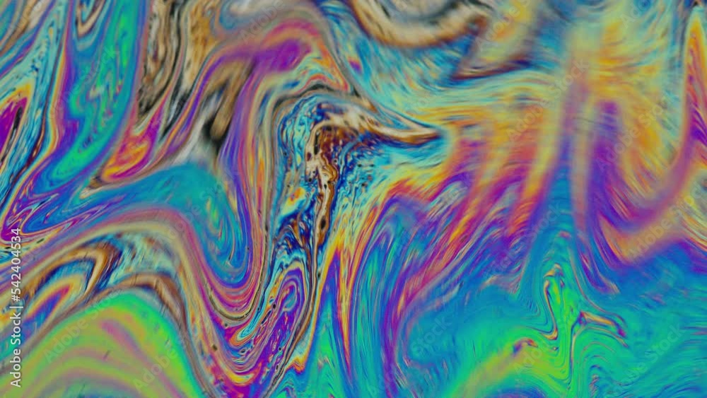 Fluid soap bubble psychedelic colorful abstract art. Surreal patterns with rainbows and waves of color in motion.