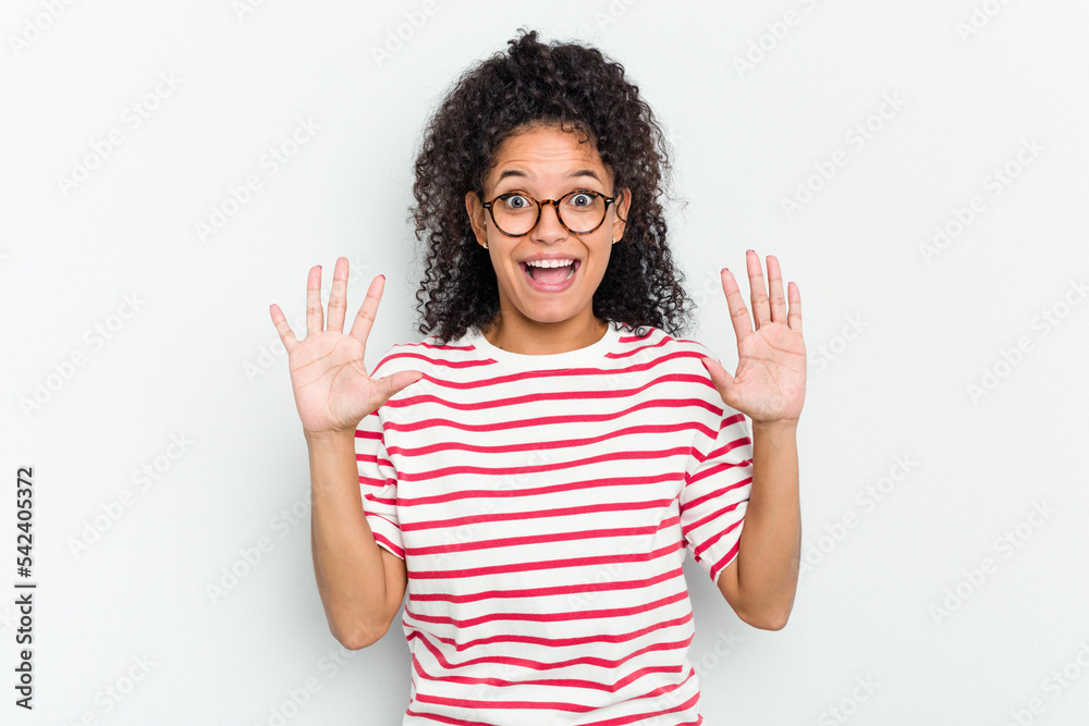 Young african american woman isolated receiving a pleasant surprise, excited and raising hands. Young african american woman isolated receiving a pleasant surprise, excited and raising hands.