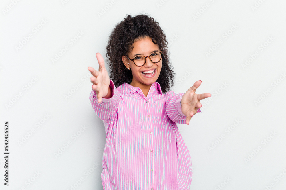 Young african american woman isolated feels confident giving a hug to the camera. Young african american woman isolated feels confident giving a hug to the camera.