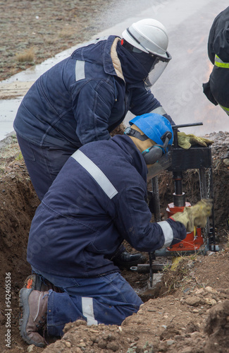 gas industry workers working on a gas pipeline in a fire emergency