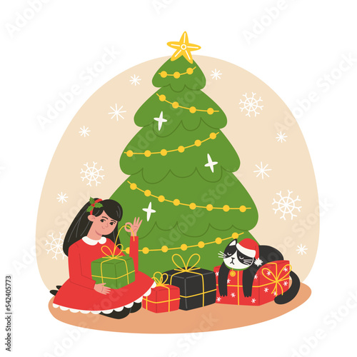 Girl unpacks gifts under the Christmas tree