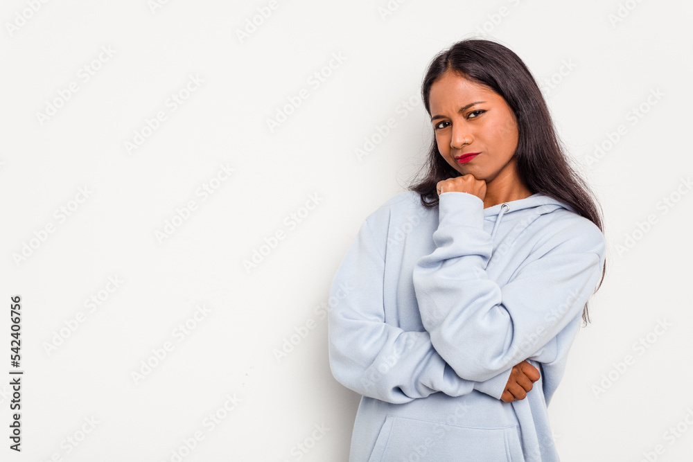 Young Indian woman isolated on white background who feels sad and pensive, looking at copy space. Young Indian woman isolated on white background who feels sad and pensive, looking at copy space.