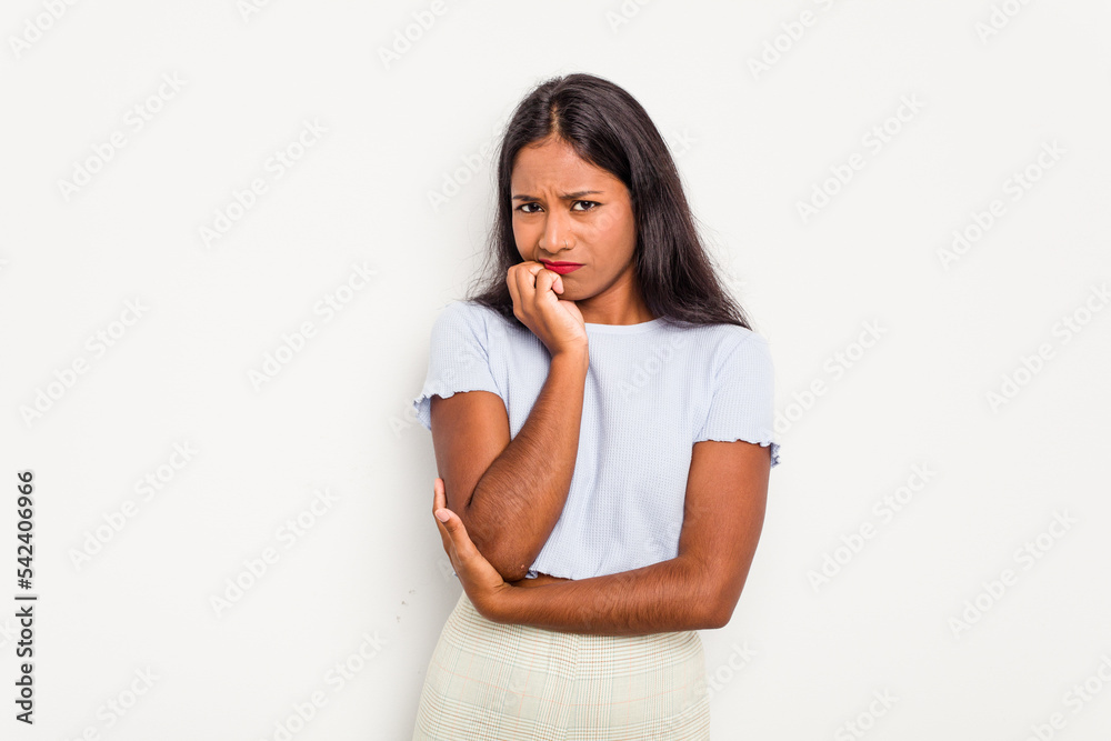 Young Indian woman isolated on white background biting fingernails, nervous and very anxious. Young Indian woman isolated on white background biting fingernails, nervous and very anxious.