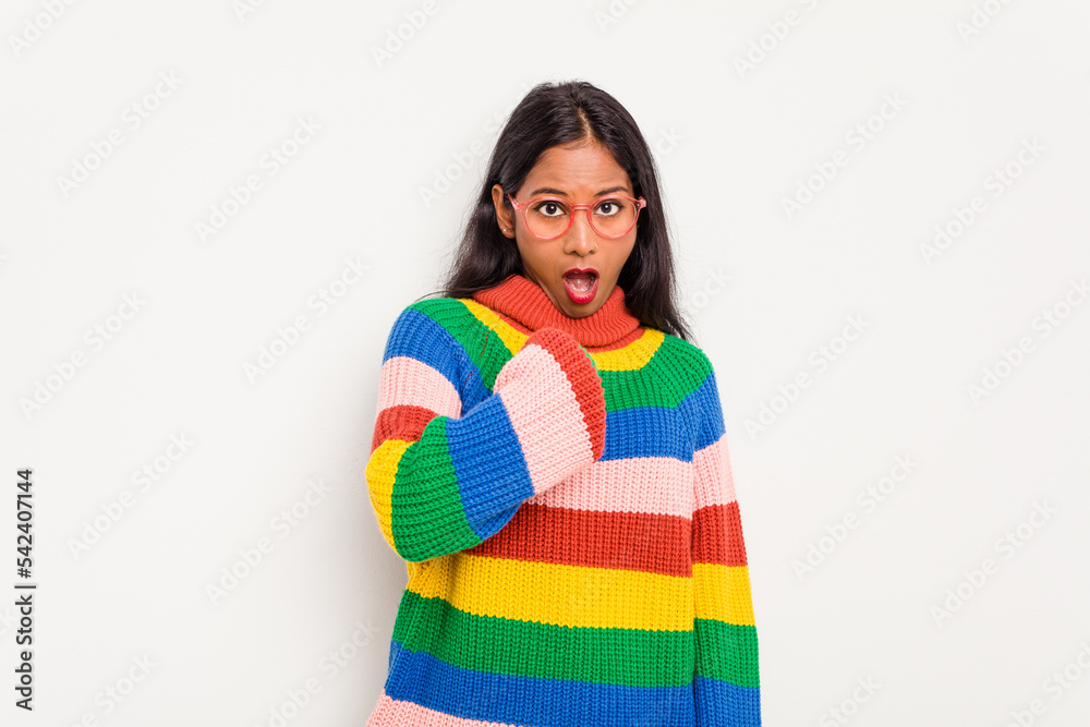 Young Indian woman isolated on white background surprised pointing with finger, smiling broadly. Young Indian woman isolated on white background surprised pointing with finger, smiling broadly.