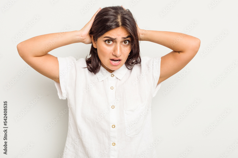 Young Indian woman isolated on white background screaming, very excited, passionate, satisfied with something. Young Indian woman isolated on white background screaming, very excited, passionate, satisfied with something.