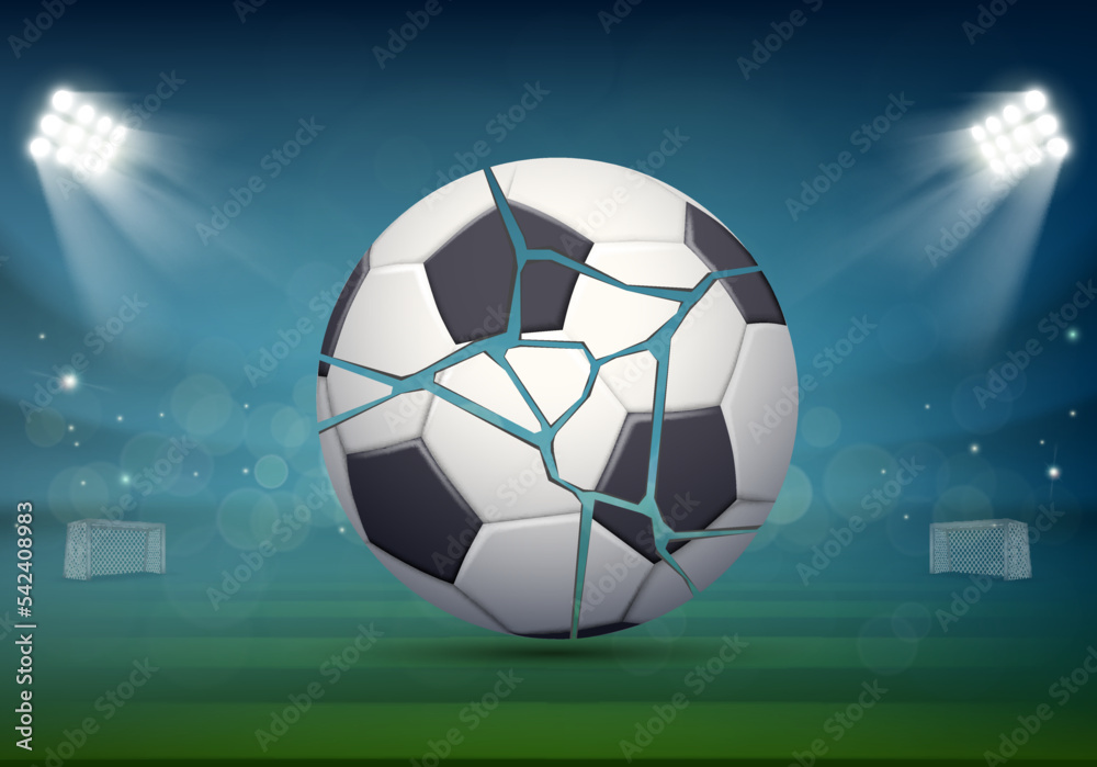 Obraz premium Bursting and torn soccer ball lies on the grass