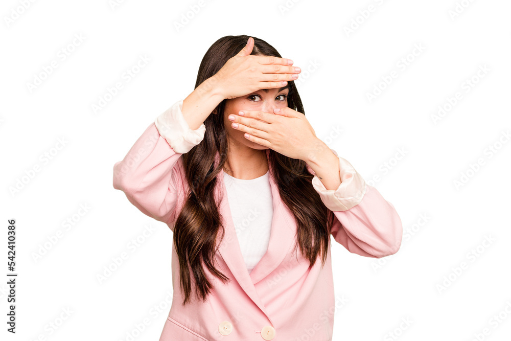 Young caucasian woman isolated on green chroma background blink at the camera through fingers, embarrassed covering face. Young caucasian woman isolated on green chroma background blink at the camera through fingers, embarrassed covering face.