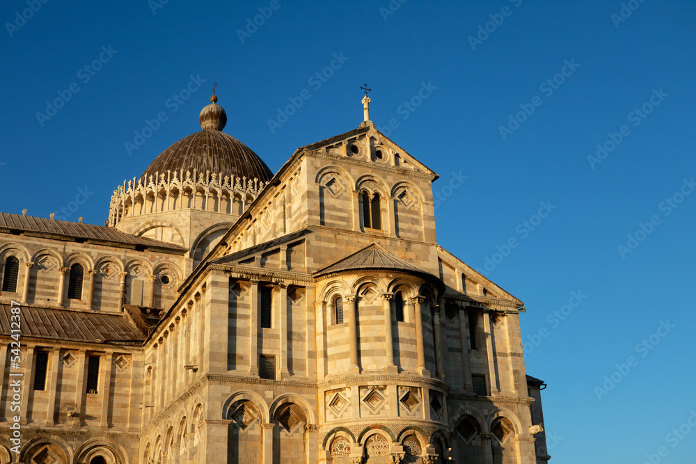Pisa cathedral sunset light colors against blue sky