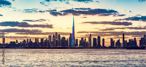 Skyscrapers skyline of Dubai UAE downtown with Burj Khalifa at sunset