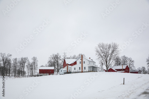 Amish farm on a snowy hill in the winter in Holmes County, Ohio