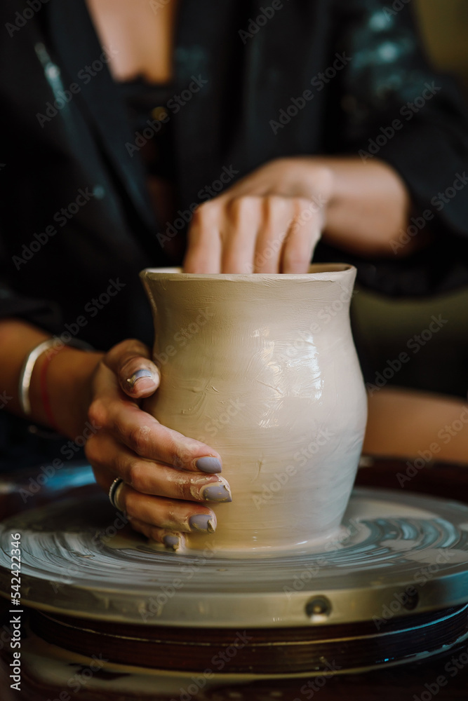 Master class on modeling of clay on a potter's wheel In the pottery workshop Master class on modeling of clay on a potter's wheel In the pottery workshop
