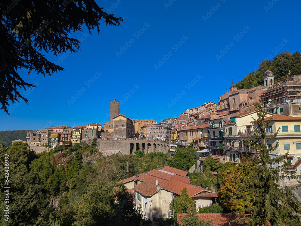 View on ancient town Nemi, located on Alban hills overlooking volcanic crater lake Nemi, Castelli Romani, Italy in autumn