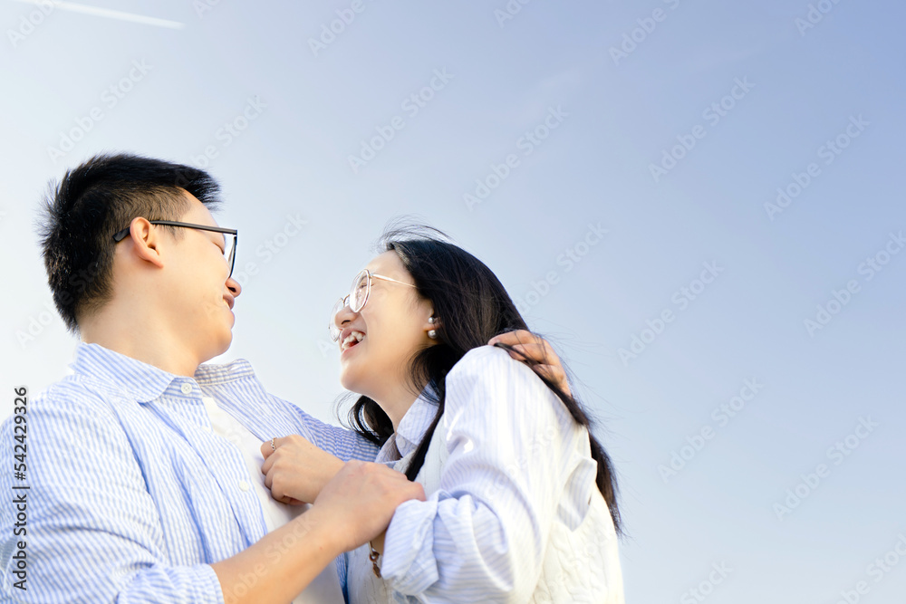 Young beautiful couple having fun outdoors - Portrait of Asian guys smiling - Japanese family, Cheerful woman and man bonding - Love Concept - Youth culture -Multiracial People 