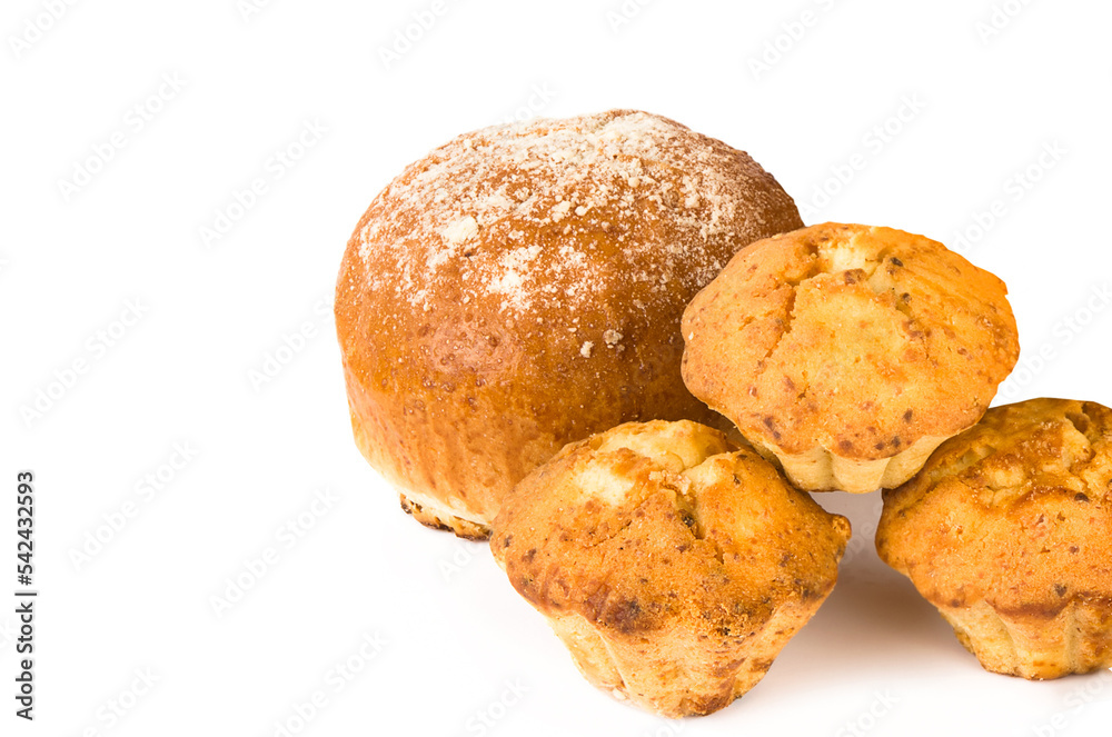 Sweet bun and muffins isolated on white. There is free space for text. Sweet bun and muffins isolated on white. There is free space for text.