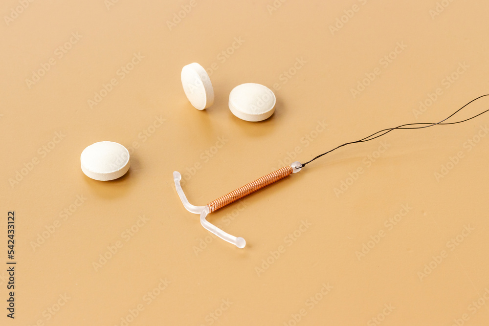Tshaped intrauterine contraceptive device with medicine pills