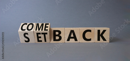 Comeback and setback symbol. Turned cubes with words setback and comeback. Beautiful grey background. Business concept. Copy space photo