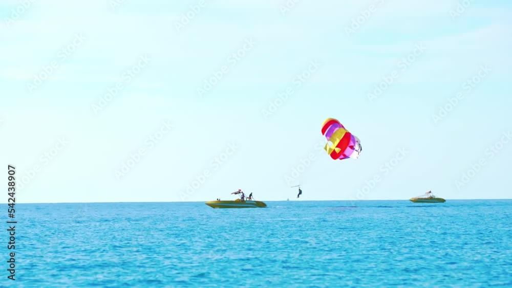 magnificent view of colorful parasail wing pulled by a boat in the bright blue sea, Alanya, Turkey. High quality 4k footage magnificent view of colorful parasail wing pulled by a boat in the bright blue sea, Alanya, Turkey. High quality 4k footage