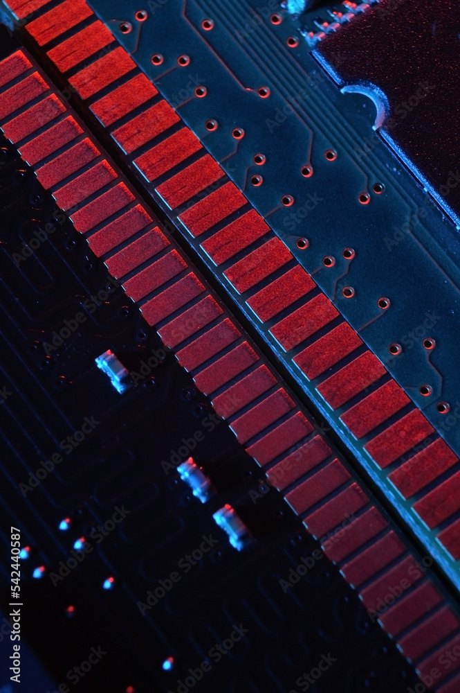 Computer cpu processor chip on circuit board ,motherboard background. Close-up. With red-blue lighting Computer cpu processor chip on circuit board ,motherboard background. Close-up. With red-blue lighting