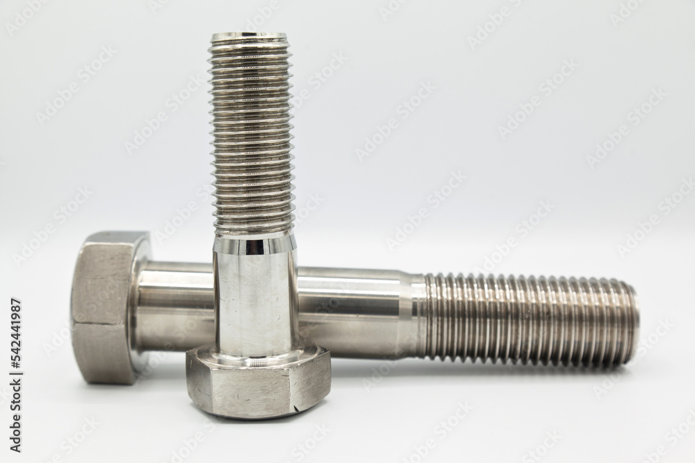 Stainless steel metal with metric A4 bolts, industrial metal part, isolated on white background Stainless steel metal with metric A4 bolts, industrial metal part, isolated on white background