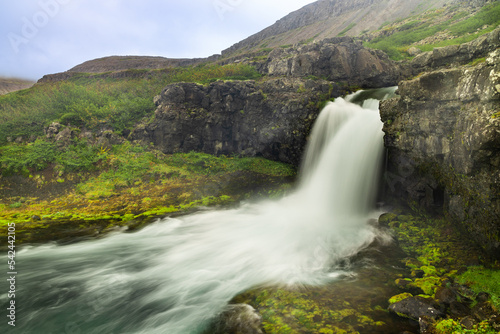 Gongumannafoss, one of the 5 waterfalls below Dynjandi waterfall located in Arnarfjordur, Iceland. It is the largest waterfall in the Westfjords and has a total height of 100 metres.