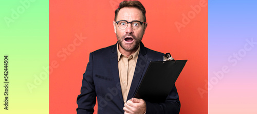 Принти на полотні middle age man looking very shocked or surprised with an inventory