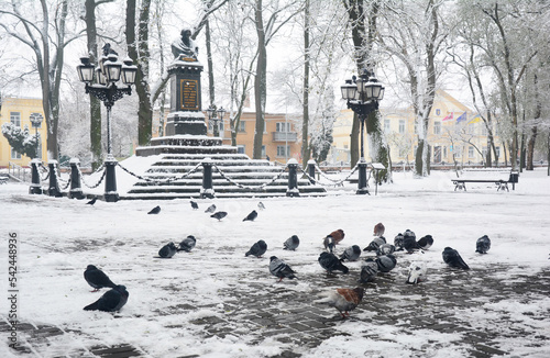 Nikolai Gogol First Monument in Nizhyn, Ukraine, coverd snow in Winter. photo