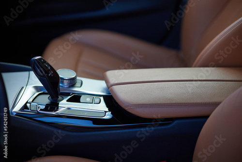 Detail of the new modern car interior, gear shift in new luxurious car
