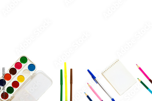 Office stationery with markers and other supplies on a white background. business background