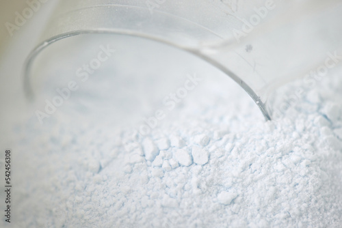 white powder for cosmetic and glass jar photo