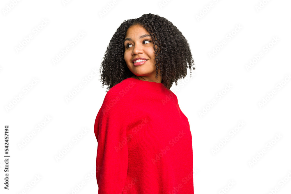 Young african american woman isolated looks aside smiling, cheerful and pleasant. Young african american woman isolated looks aside smiling, cheerful and pleasant.