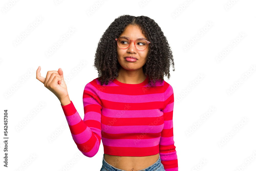 Young african american woman isolated pointing with finger at you as if inviting come closer. Young african american woman isolated pointing with finger at you as if inviting come closer.
