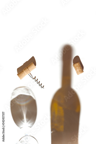 Creative composition made of corkscrew and cork of wine on white background with glass and bottle shadows. Date, party and celebration concept. Top view. Flat lay