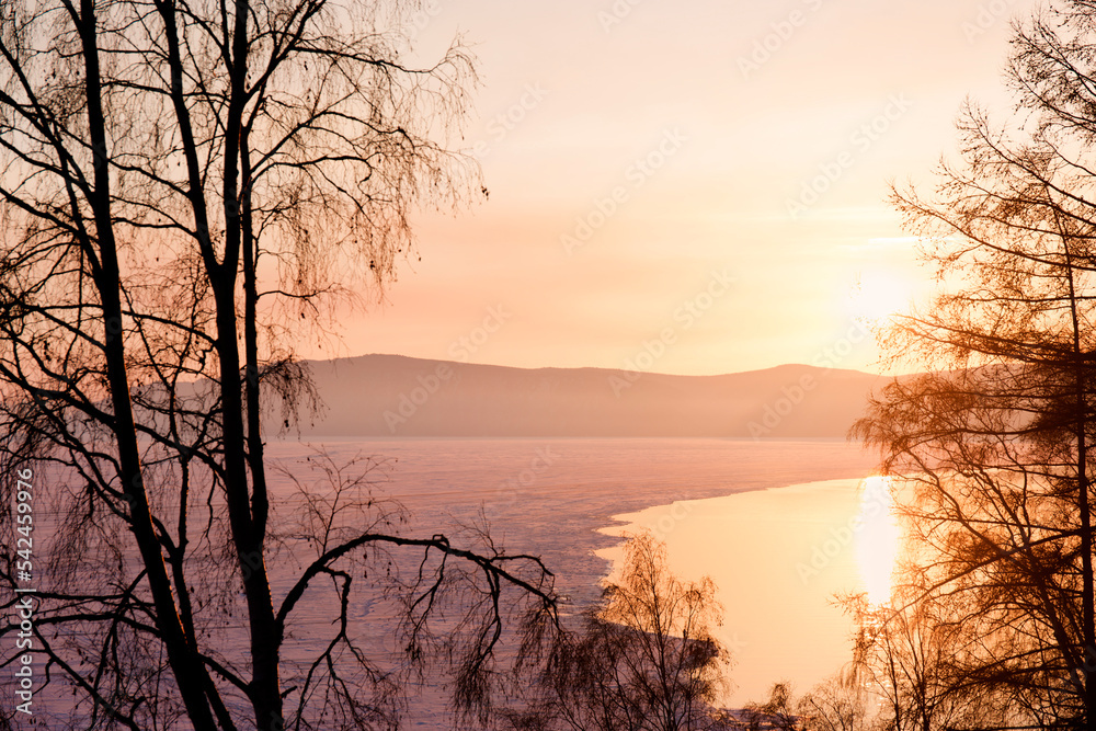 Beautiful sunset on frozen lake Baikal. Winter landscape. Beautiful sunset on frozen lake Baikal. Winter landscape.