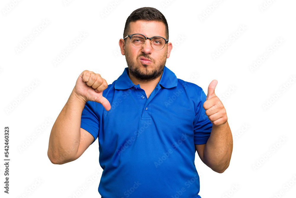 Young caucasian man isolated showing thumbs up and thumbs down, difficult choose concept Young caucasian man isolated showing thumbs up and thumbs down, difficult choose concept