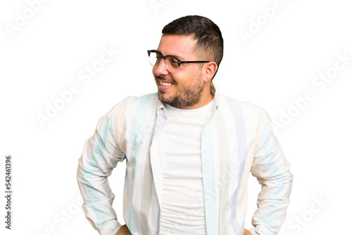 Young caucasian man isolated laughs happily and has fun keeping hands on stomach.
