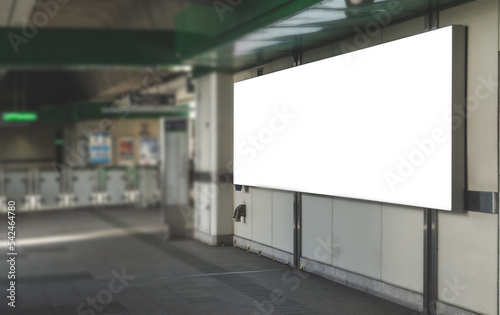 large blank advertise billboard white LED screen horizontal for design banner announcement exit way at outdoor public sky train platform station.